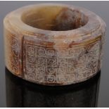 A Chinese carved hardstone cylinder seal, with engraved geometric designs, diameter 6.