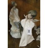 A Lladro angel and a Lladro shepherd boy.