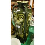 A tall continental Art Nouveau vase with stylised floral panels.