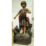 A French painted pottery sculpture, girl feeding hens, height 59cm.