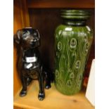 A Beswick fireside black Labrador, no. 2314 and a German pottery vase.