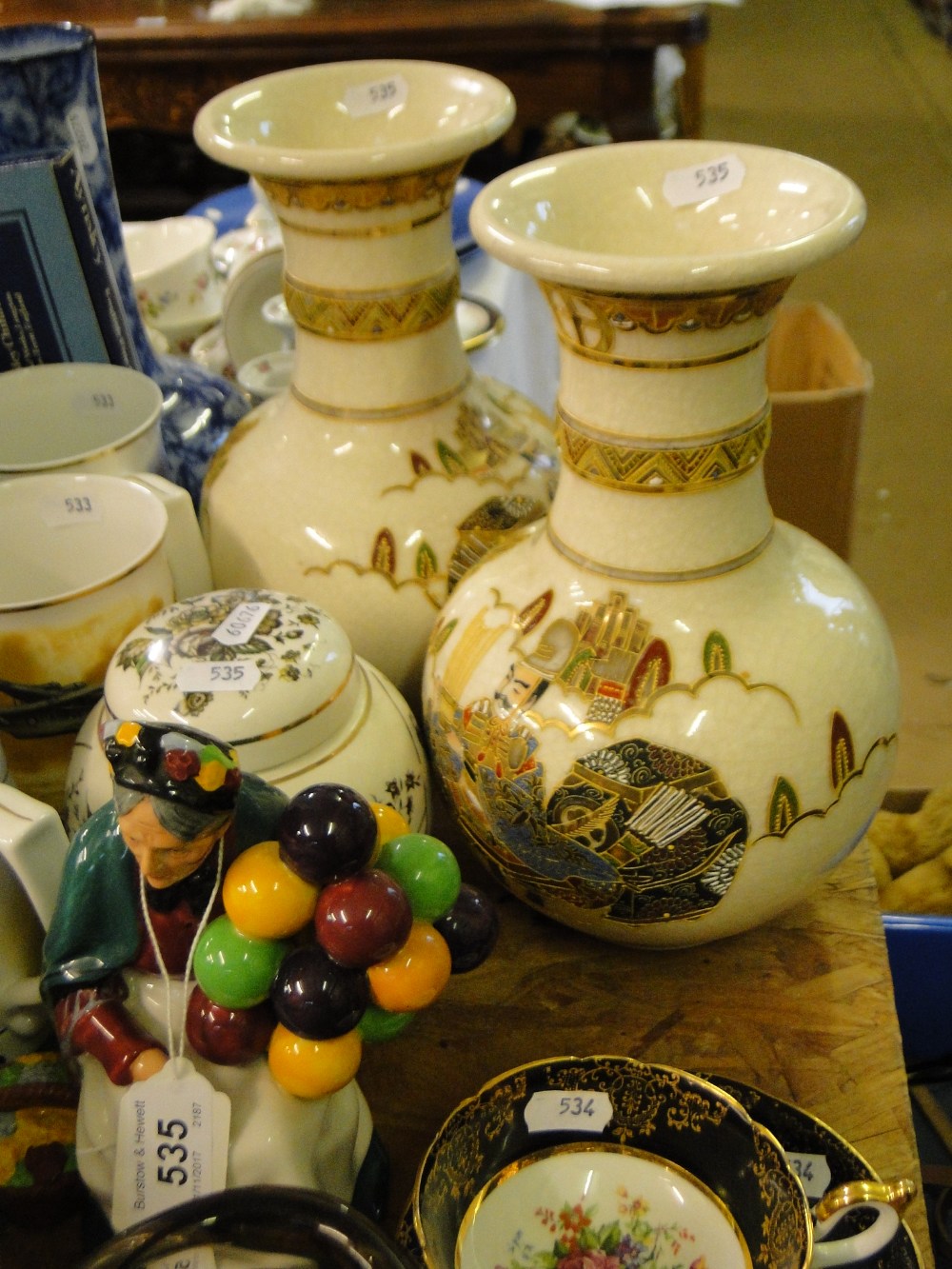 Royal Doulton "Old Balloon Seller," pair of Oriental vases and a ginger jar.