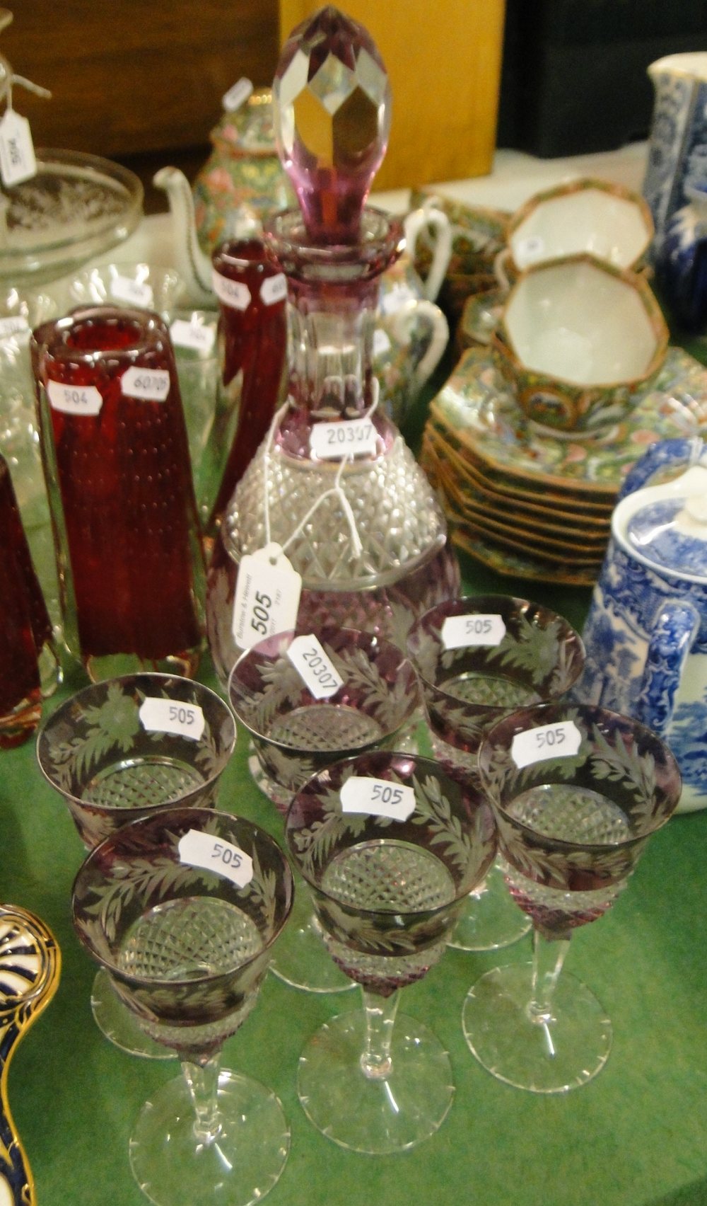 A crystal decanter and 6 matching glasses.