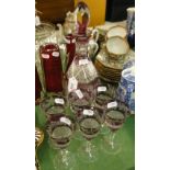 A crystal decanter and 6 matching glasses.