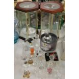 A pair of display cabinets for crystal ornaments, miniature crystal figures including Swarovski.
