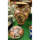 A pair of Imari baluster vases and 2 plates.