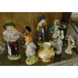 A group of English and continental porcelain, including German porcelain monkey band figure,