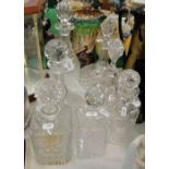 Crystal decanters and stoppers and a ships decanter.