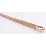 A 15ct gold topped walking cane, with animal hide shaft.