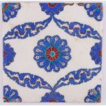 A Turkish Kutahya hand painted pottery tile, geometric designs, width 24cm.