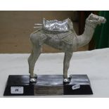 A silvered model of a camel with 1977 presentation plaque