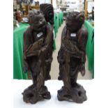 Pair of carved wood oriental figures holding fish