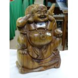 A carved wood Buddha