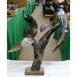 Carved cow horn parrot figures on stand