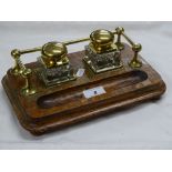 Oak desk stand with brass mounted inkwells