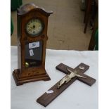 Tabletop inlaid longcase clock and a crucifix