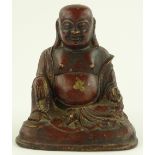 A Chinese gilded and patinated bronze seated Buddha, height 16cm.