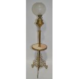 An ornate embossed brass Odin floor standing oil lamp,