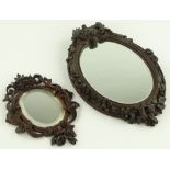 2 Ornate 19th century carved and stained beech framed oval wall mirrors, largest height 48cm, (2).