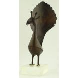 An American Folk Art patinated metal peacock, stenciled decoration on perspex plinth,