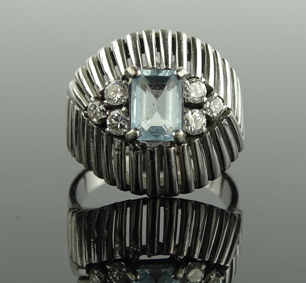 An aquamarine and diamond set ring circa 1940s, aqua height 7mm, unmarked 18ct white gold settings.