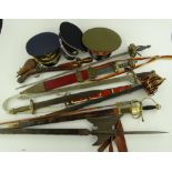 A group of replica weapons, caps, swords, etc.