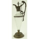 A Victorian cut-glass and spelter claret jug, height 43cm.