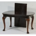 Edwardian mahogany wind out dining table,