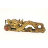 Chinese carved giltwood pen stand, 19th Century, formed as a dragon chasing a flaming pearl,