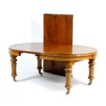 Victorian oak wind out dining table, circa 1870, circular when closed,