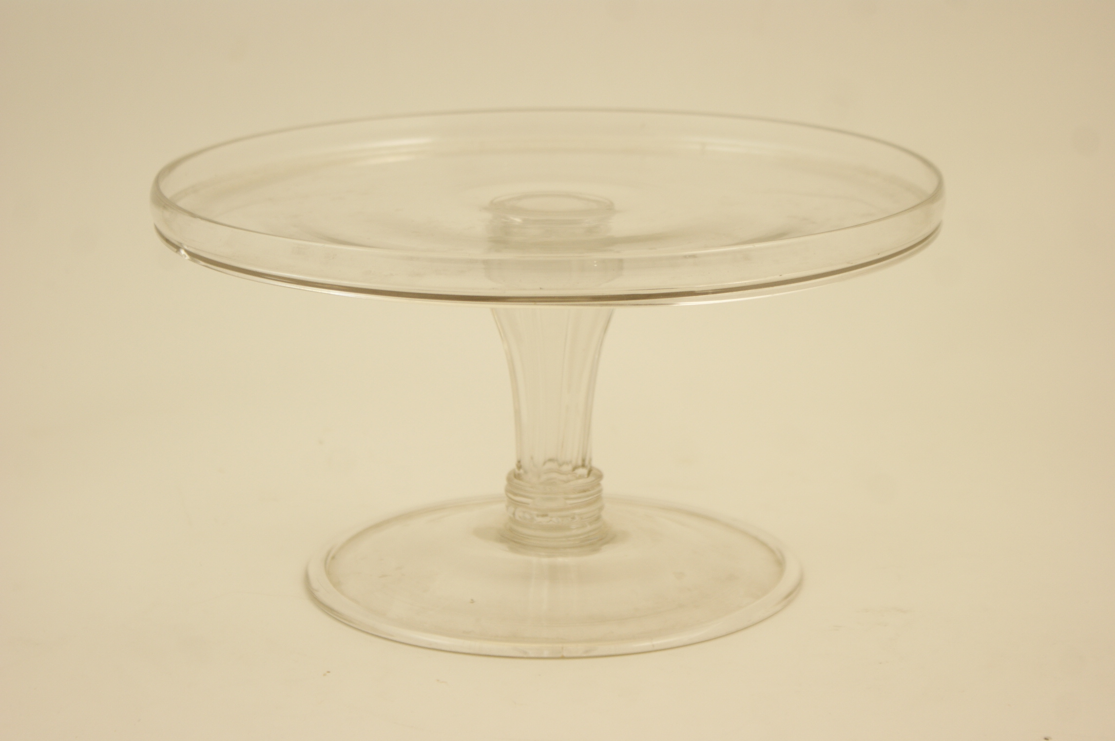 George III glass comport, the top with a flange over a moulded Silesian stem and wide folded foot,