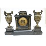 French polished slate and bronze composed clock garniture, circa 1875,