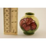 Moorcroft miniature Hibiscus vase, globular form with yellow green ground, printed marks,