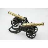 Pair brass and cast iron cannons, 25.