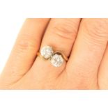 Attractive cubic zirconia two stone crossover ring, the brilliant cut stones of approx.