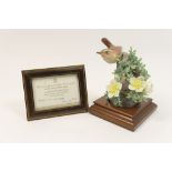 Royal Worcester model of a wren and burnet rose, circa 1964,