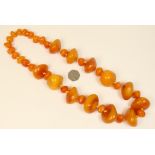 Large butterscotch amber pebble necklace, the largest beads approx.