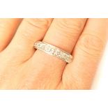 Diamond half eternity ring, channel set in 18ct white gold with nine graduated brilliant cut stones,