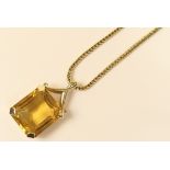 Citrine pendant necklace in 9ct gold, the large single step cut citrine of approx.