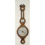 Victorian rosewood wheel barometer, swan neck pediment over a humidity dial, silvered thermometer,