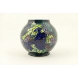 Moorcroft Finches pattern globular vase, decorated predominantly in dark blue and purple colours,