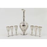 Russian silver vodka set, circa 1908, maker HC, comprising baluster ewer with a narrow neck,