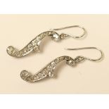 Pair of diamond pendant earrings, of italic 'f' form, channel set with old brilliant cut diamonds,