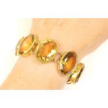 Late Victorian or Edwardian citrine bracelet, oval cut stones graduating in size,