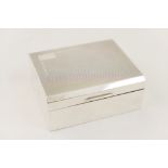 Walker & Hall silver cigarette box, Sheffield 1954, engine turned decoration and a vacant cartouche,