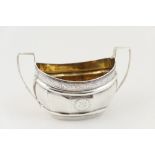 George III silver sucrier, London 1802, faceted oval form with a foliate engraved and reeded rim,