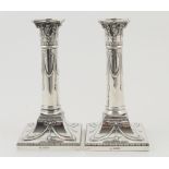 Pair of George V silver candlesticks, by Thomas Bradbury & Son, Sheffield 1919,