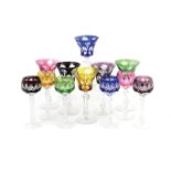 Two sets of six Czechoslovakian harlequin wine glasses,