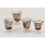 Four early Victorian Gaudy Welsh cache pots, each of tapered footed form with everted rim,