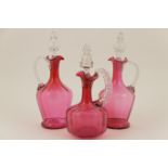 Matched pair of Victorian cranberry glass claret jugs, circa 1890,